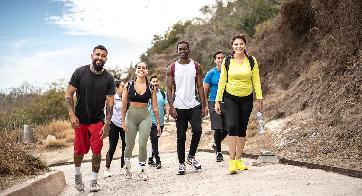 portrait of friends hiking outdoors