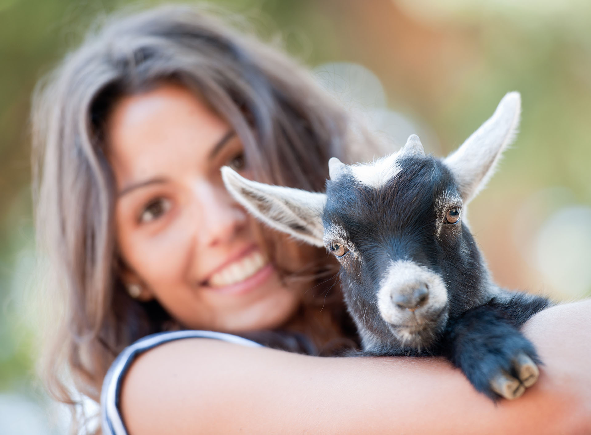 girl holding a baby goat (xxxl)